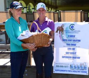 Anna Niehaus (left) won the Most Improved Rider prize, sponsored by Choice of Champions International, at the Gold Coast Dressage Association Clinic with Grand Prix trainer Devon Kane (right) (Photo courtesy of JRPR— no photo credit necessary)